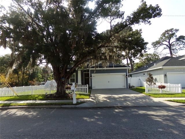 obstructed view of property featuring a garage