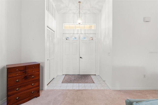 entryway with light tile patterned floors