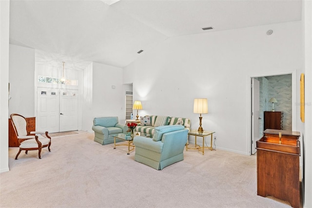 living room featuring lofted ceiling and light colored carpet