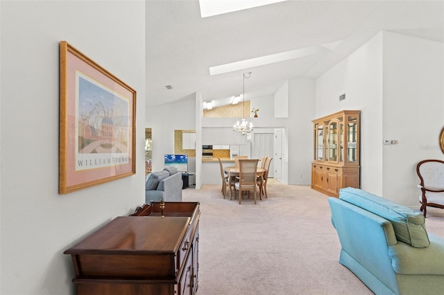 interior space featuring a skylight, high vaulted ceiling, and a notable chandelier