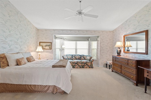 bedroom with light carpet and ceiling fan