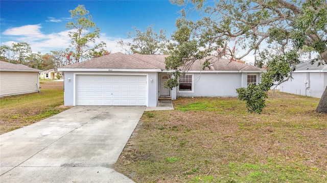 ranch-style home with a garage and a front yard