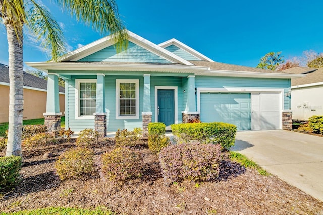 craftsman house featuring a garage and a porch