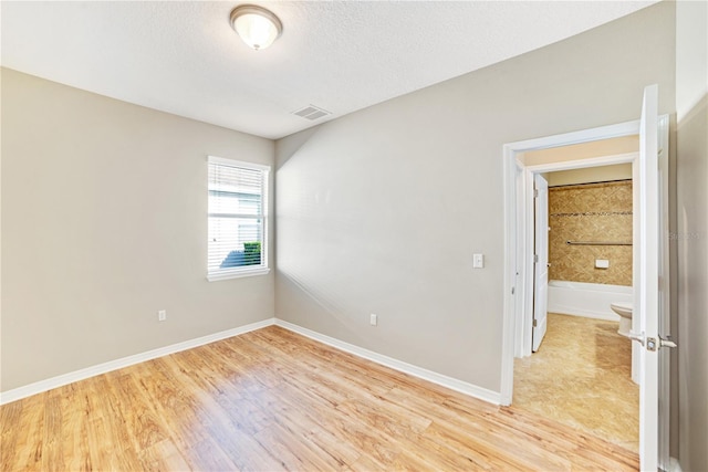 unfurnished room featuring light hardwood / wood-style floors