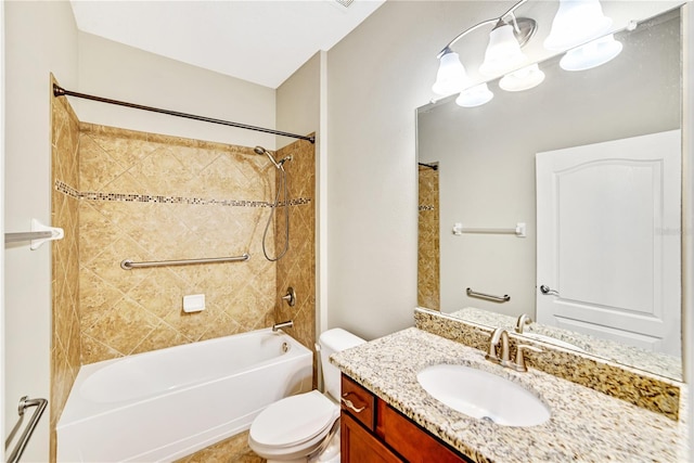 full bathroom with tiled shower / bath combo, vanity, and toilet