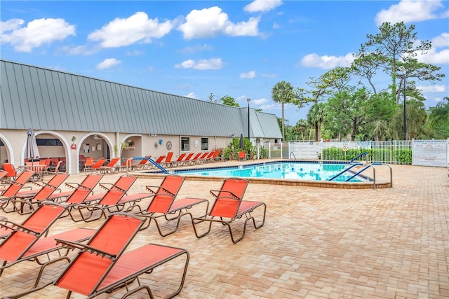 view of swimming pool with a patio area