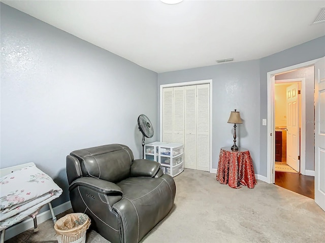 sitting room featuring carpet floors