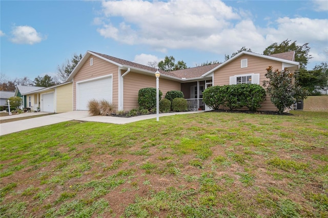 ranch-style home with a garage and a front lawn