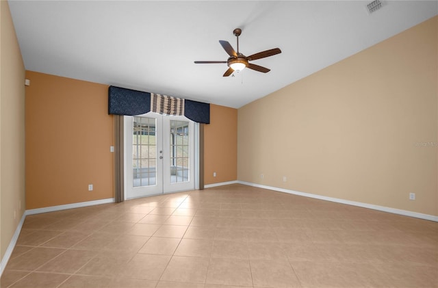 unfurnished room featuring ceiling fan, french doors, and light tile patterned flooring