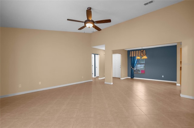 tiled spare room with ceiling fan