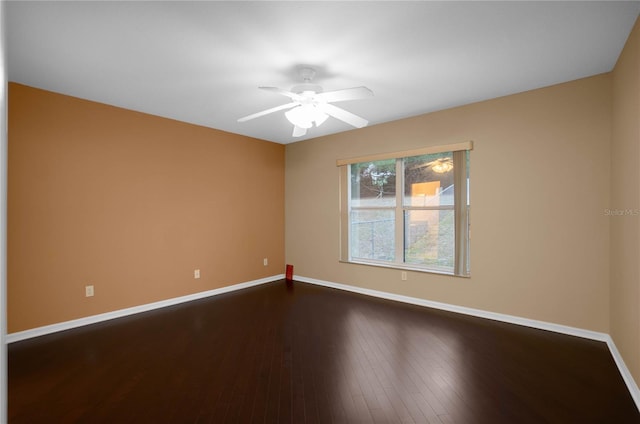 unfurnished room featuring ceiling fan and dark hardwood / wood-style floors