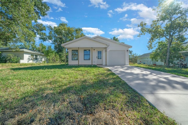 view of front facade with a garage, a front lawn, and covered porch