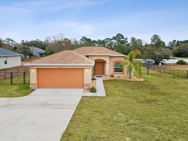 view of front of house featuring a garage and a front yard