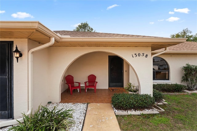 doorway to property with a patio