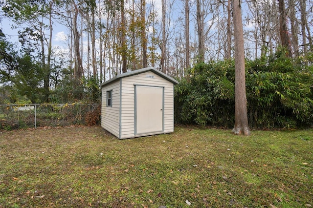 view of outbuilding with a lawn