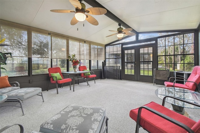 sunroom / solarium featuring vaulted ceiling with beams, a healthy amount of sunlight, and ceiling fan