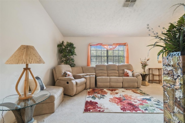 living room with light colored carpet and a textured ceiling