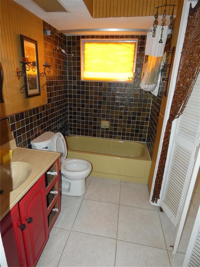 bathroom with tile patterned floors, shower / tub combination, vanity, and toilet