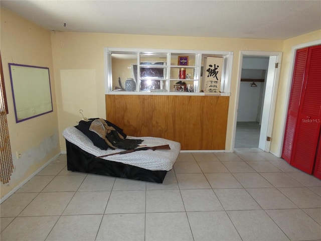 living area with tile patterned floors