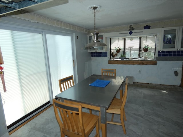 dining room with concrete flooring