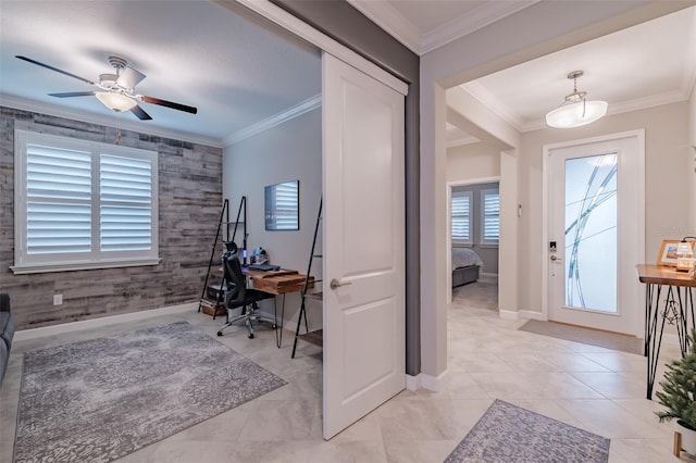 interior space featuring crown molding, plenty of natural light, and ceiling fan