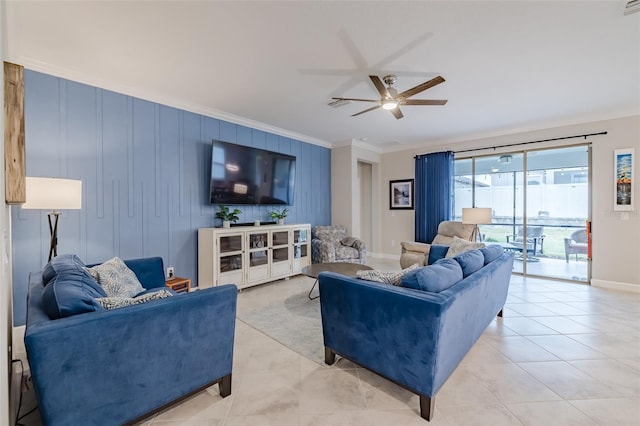 tiled living room featuring ceiling fan and ornamental molding