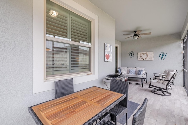 dining room with light hardwood / wood-style flooring and ceiling fan