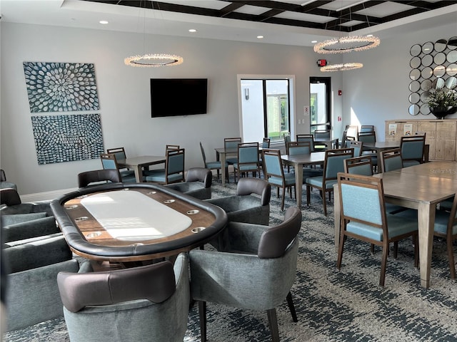 game room with coffered ceiling and beam ceiling