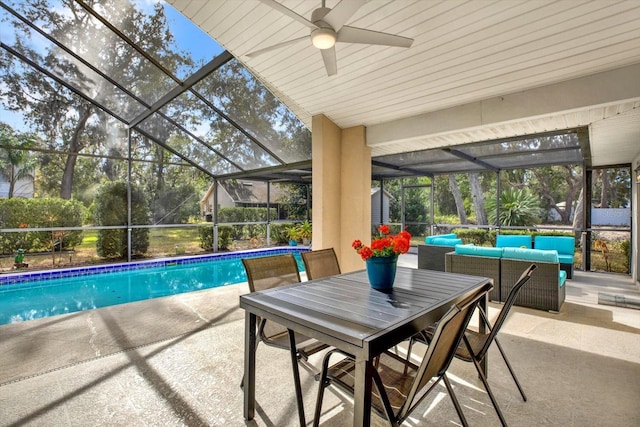 view of pool featuring ceiling fan, a lanai, an outdoor hangout area, and a patio area