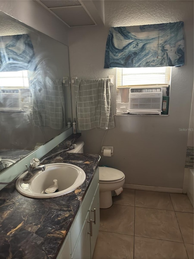 bathroom with toilet, vanity, tile patterned flooring, a tub to relax in, and cooling unit