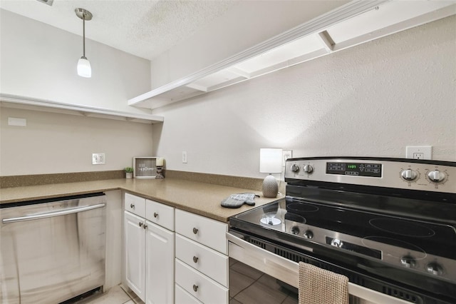 kitchen with pendant lighting, white cabinets, a textured ceiling, appliances with stainless steel finishes, and light tile patterned flooring