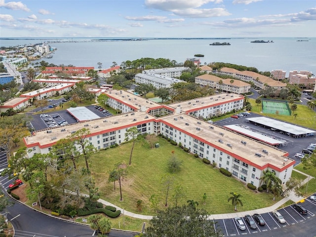 birds eye view of property with a water view