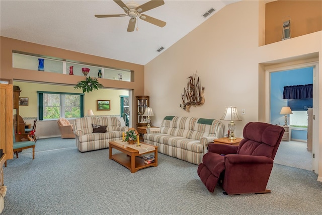 9639 Conservation Dr, New Port Richey, FL 34655 - living room with ceiling fan, carpet flooring, and high vaulted ceiling