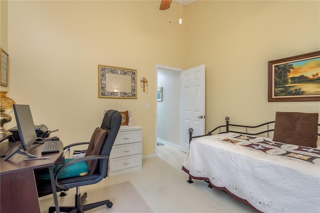 9639 Conservation Dr, New Port Richey, FL 34655 - carpeted bedroom with ceiling fan and a high ceiling