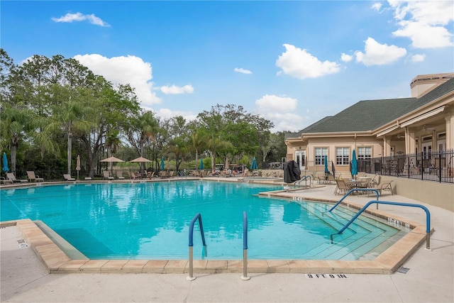 9639 Conservation Dr, New Port Richey, FL 34655 - view of swimming pool with a patio