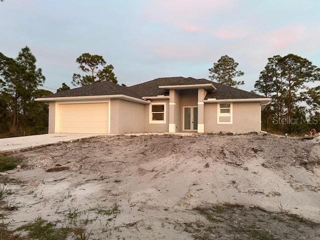 view of front of property with a garage