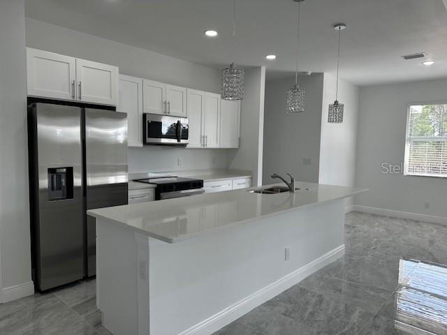 kitchen with sink, stainless steel appliances, a kitchen island with sink, and white cabinets