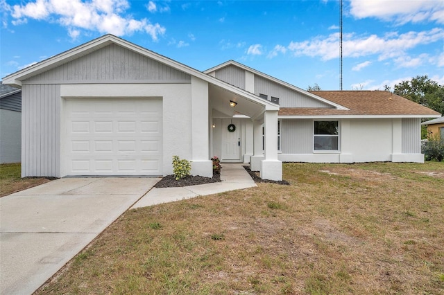 ranch-style house with a garage and a front yard