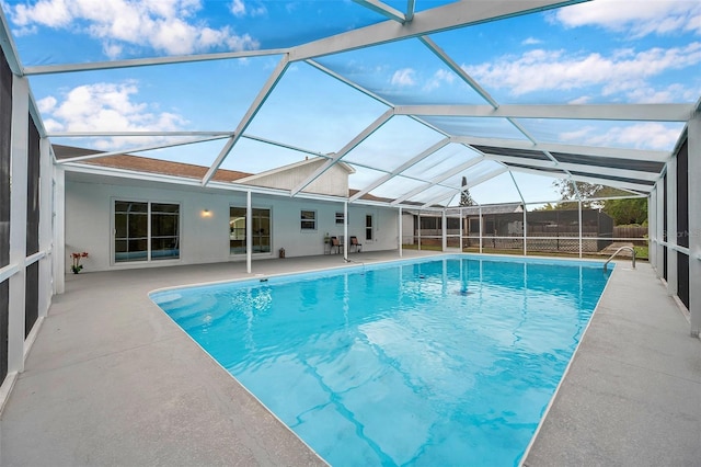 view of pool featuring a patio area and a lanai