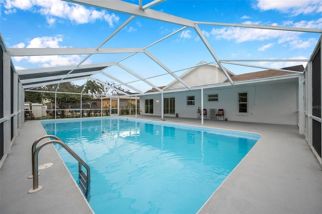 view of pool with a lanai and a patio area