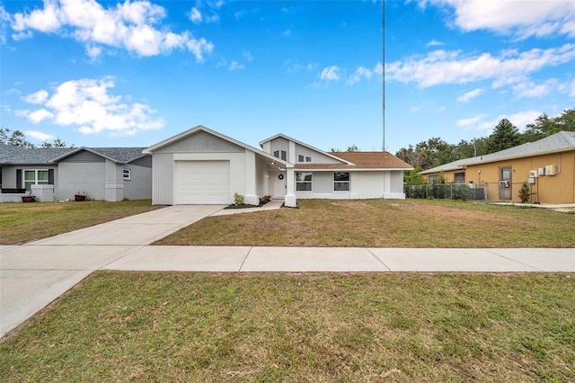 single story home with a front yard and a garage