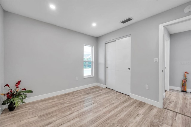 unfurnished bedroom featuring light hardwood / wood-style floors