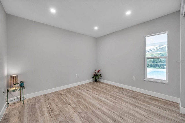 empty room with light hardwood / wood-style floors