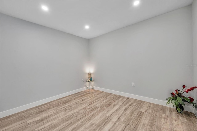 empty room with light hardwood / wood-style floors