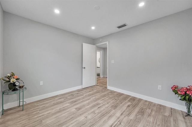 spare room featuring light hardwood / wood-style flooring