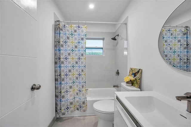 full bathroom with toilet, vanity, and shower / tub combo