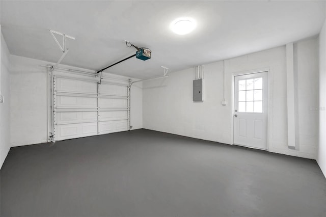 garage featuring a garage door opener and electric panel