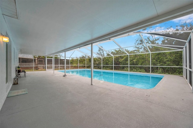 view of pool with a lanai and a patio area