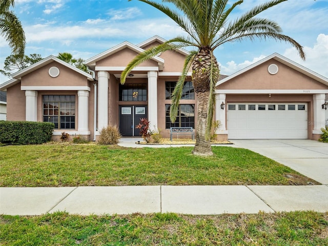 view of front facade featuring a front lawn and a garage