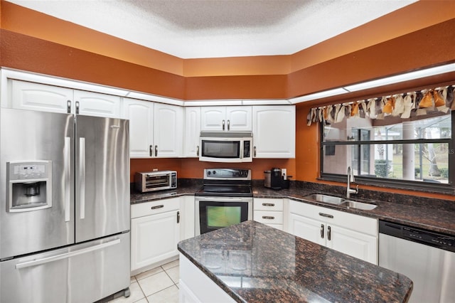 kitchen featuring white cabinets, sink, and stainless steel appliances